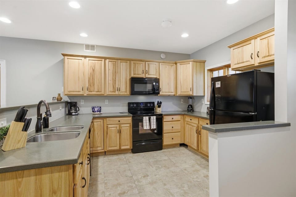 The kitchen in Unit 712 brings everyone together with an open, spacious layout that makes cooking, serving, and staying connected feel effortless.