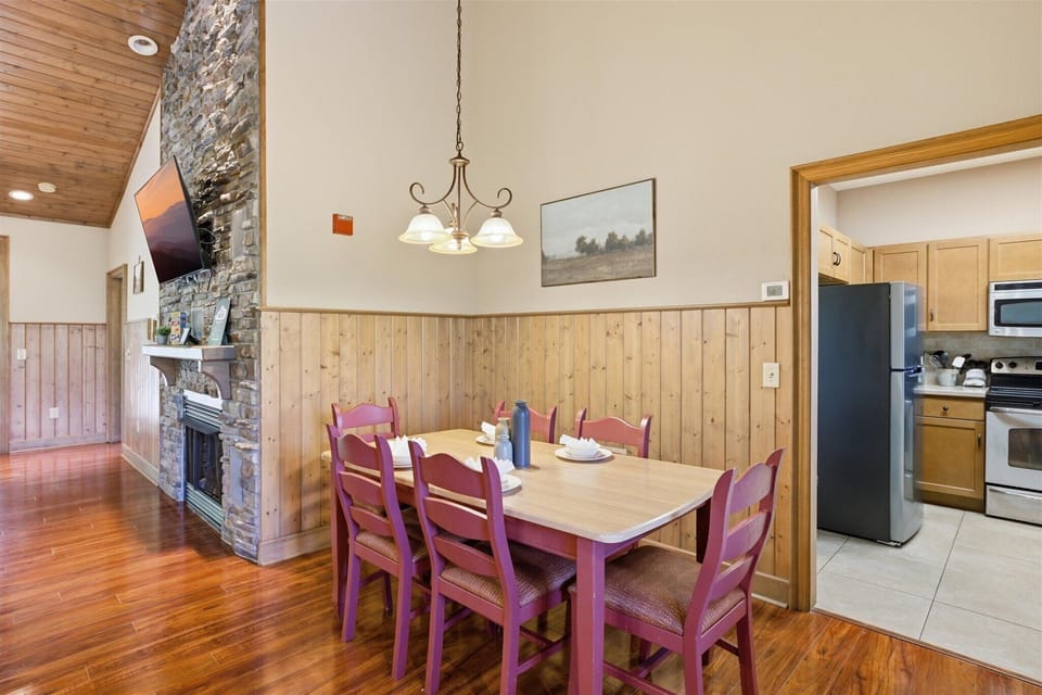 Sit down together at the dining table for six, a great spot for meals, conversation, or winding down with a game at the end of the day.