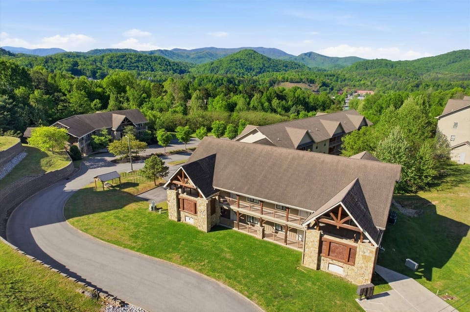 Take in the full view of Hearthstone Lodge, where the scale of the building hints at the spacious, group-friendly stays waiting inside, all set within the peaceful surroundings of Serenity Ridge Resort.
