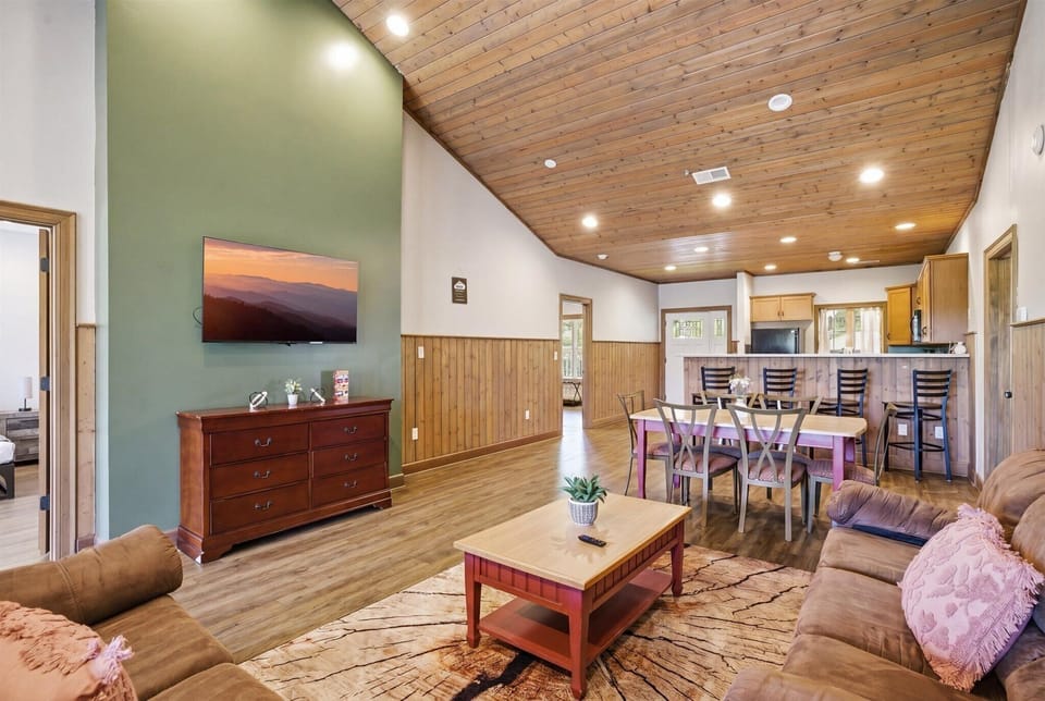 The living room invites everyone in with space to gather, stretch out, and settle into the kind of comfort that makes you want to stay a little longer.