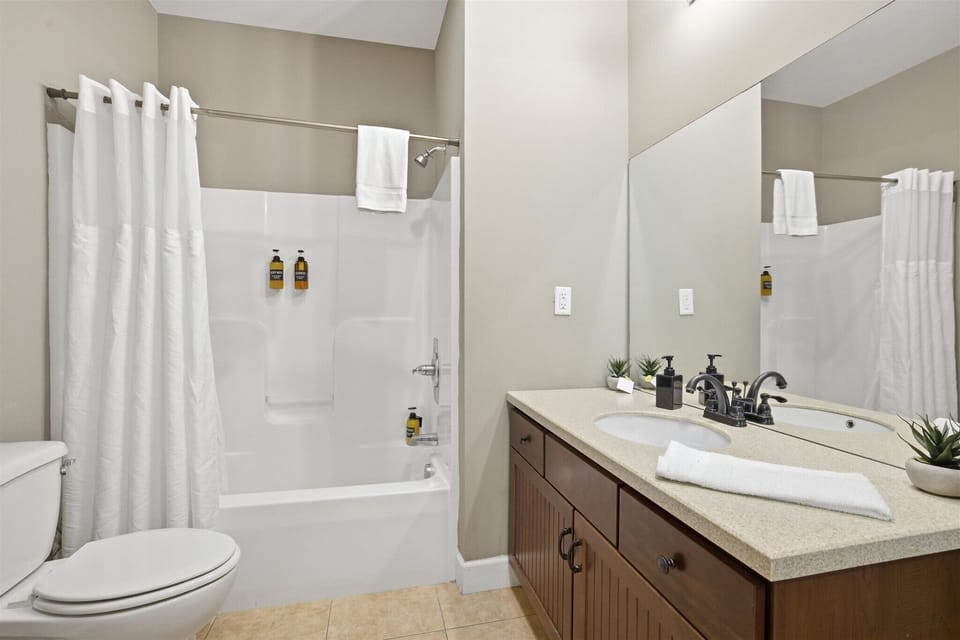 Step into this king suite bathroom, where a clean, modern design and spacious layout give you room to get ready or wind down with ease after a full day.