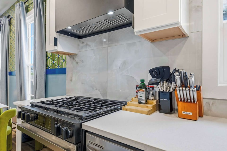 Cook like you're at home — our fully equipped kitchen features a sleek gas range and everything you need to whip up your favorite meals. 