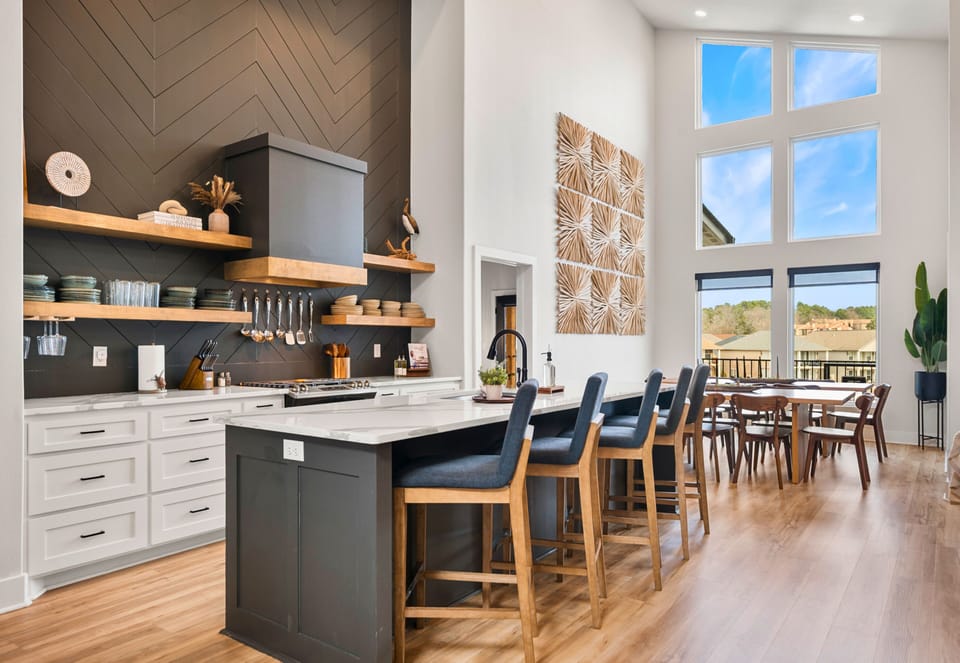 The kitchen makes a statement with its oversized island, sleek finishes, and plenty of prep space, making it just as functional as it is beautiful.