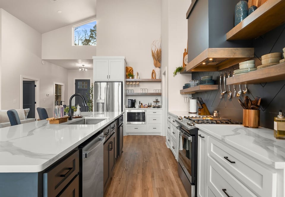 With ample cabinetry and modern finishes, this kitchen blends clean design with practical storage and workspace.
