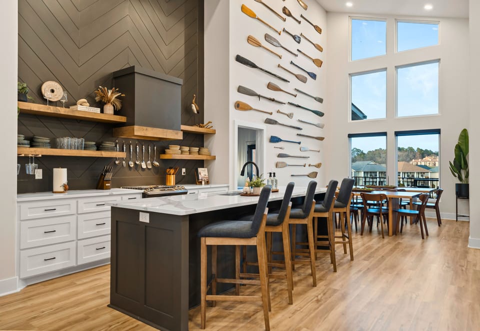 The kitchen makes a statement with its oversized island, sleek finishes, and plenty of prep space, making it just as functional as it is beautiful.