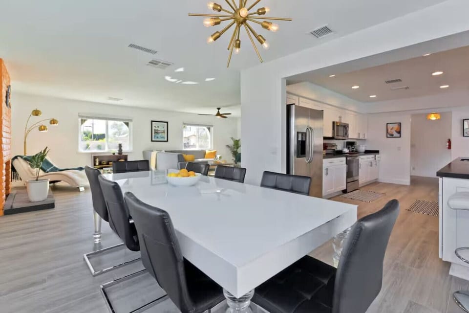 Open-concept dining space flowing seamlessly from kitchen to living room