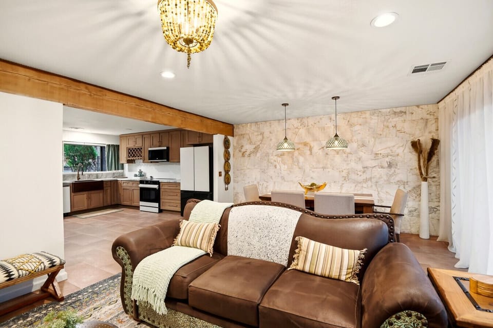 Open-concept living room, dining area, and kitchen
