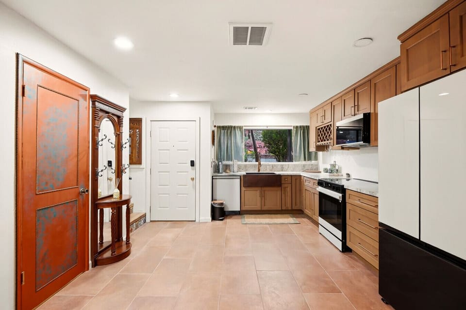 Front door and kitchen with stairs to the left