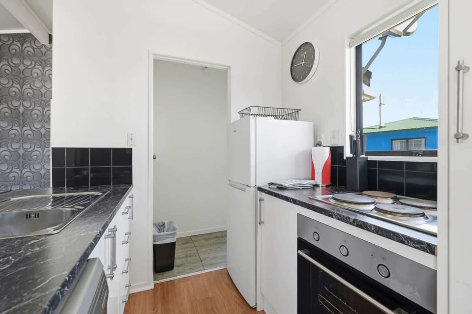 Kitchen with cooktop and full-size oven