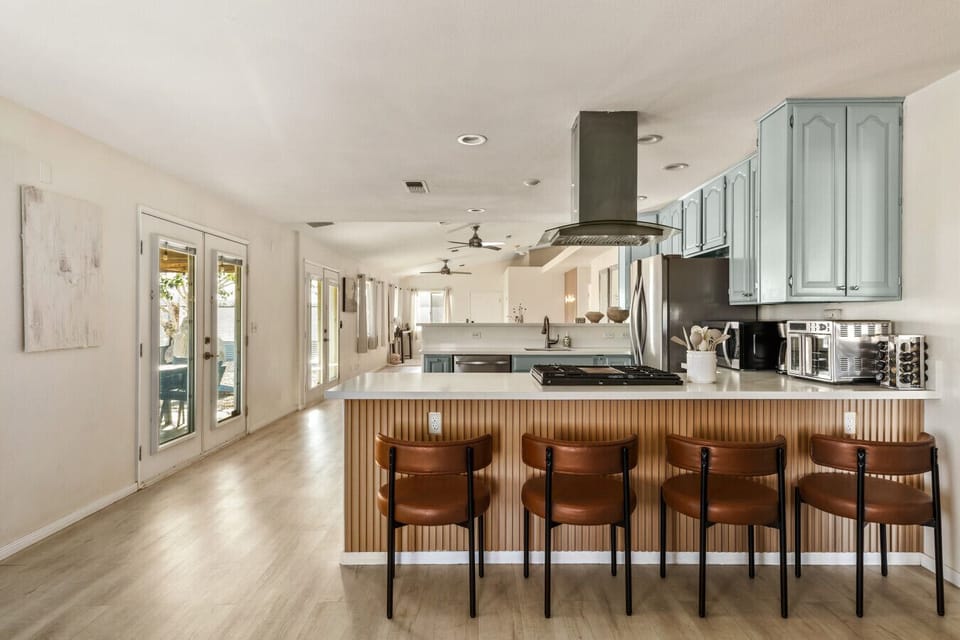 Start the day with coffee around the kitchen bar.