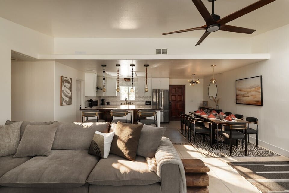 Stretch out on the sofa with the kitchen and dining area.