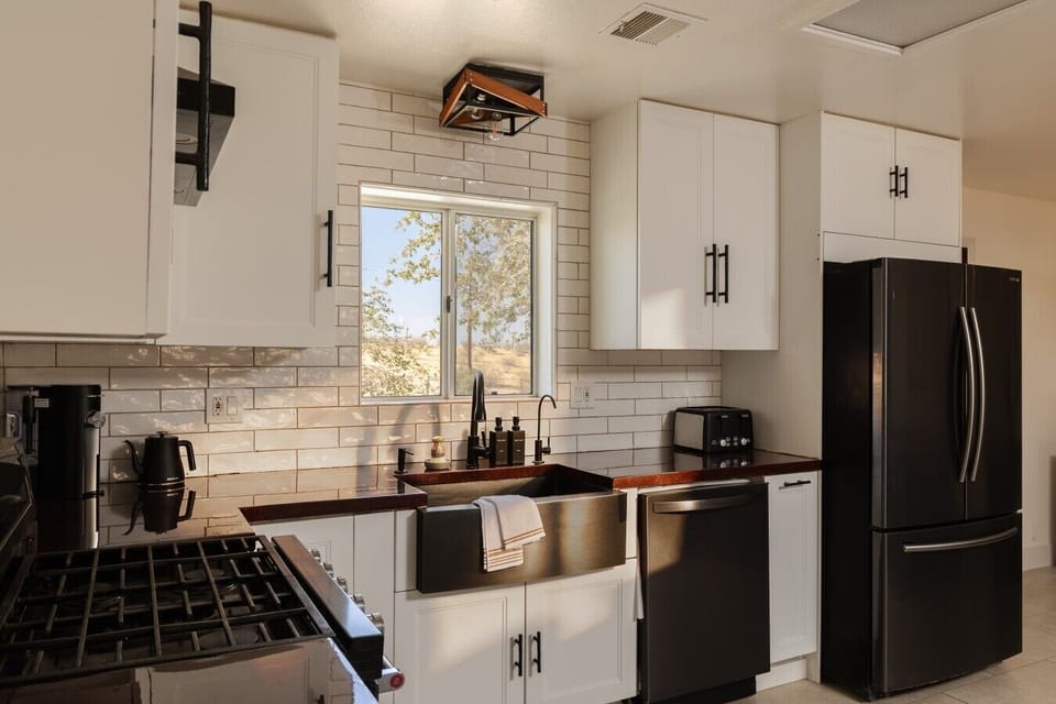 Cook and prep meals with plenty of counter space and natural light.