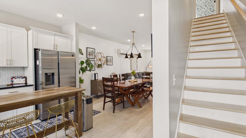 Walk into your open concept living and kitchen areas with dining bar, kitchen, and dining table