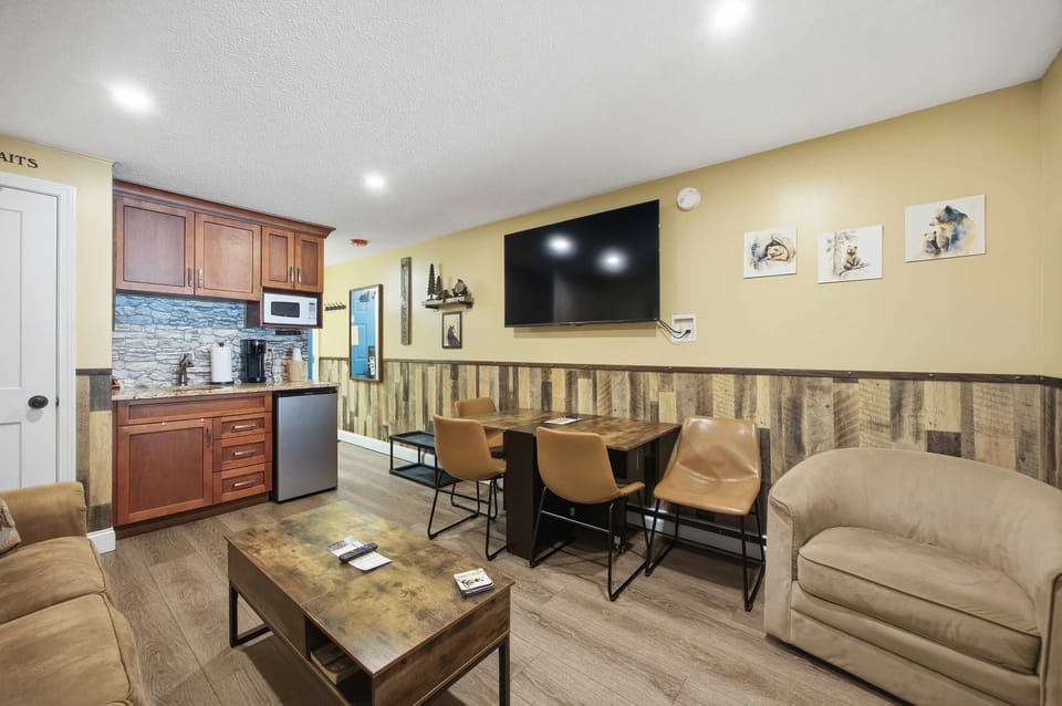 Recharge in the living room space, offering a sleeper sofa, TV, & dining table​