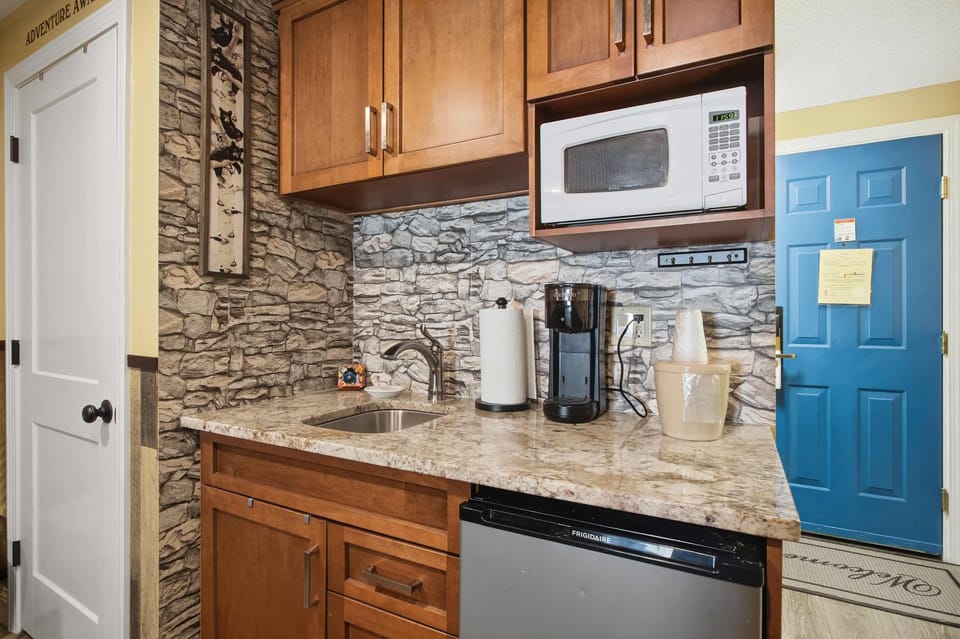 Recharge in the living room space, offering a sleeper sofa, TV, & dining table​