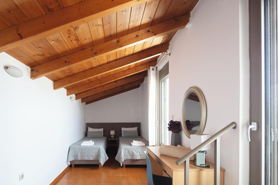 The second bedroom, located in the attic, features 2 twin size beds, which can be joined together upon request