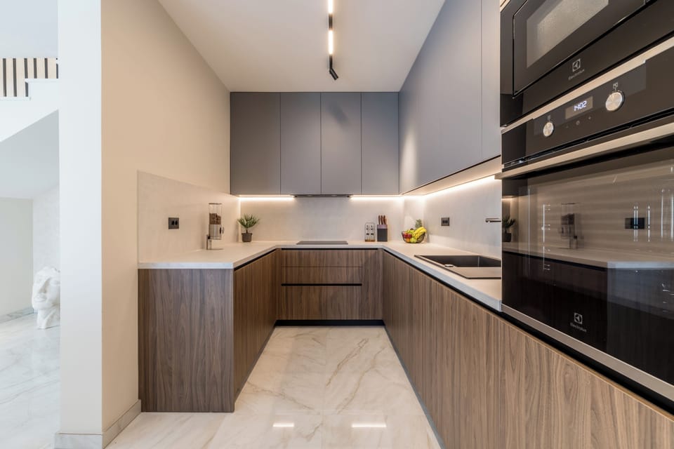 A modern kitchen with a wood design finish, featuring a functional layout.