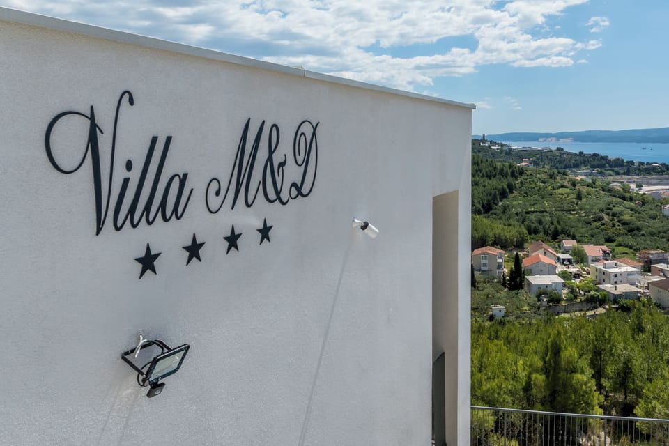The villa’s signage.