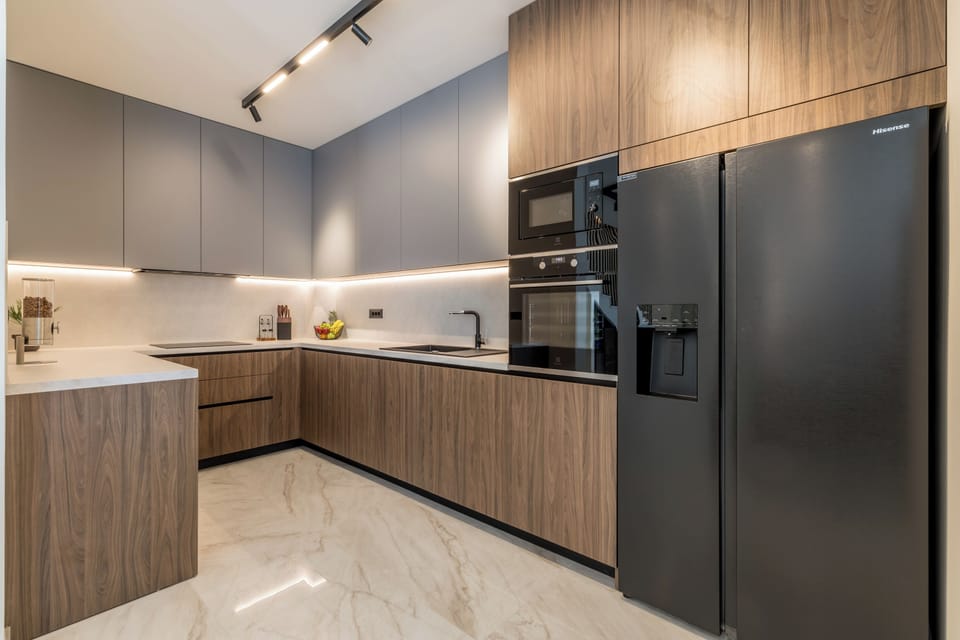 A modern kitchen with a wood design finish, featuring a functional layout.