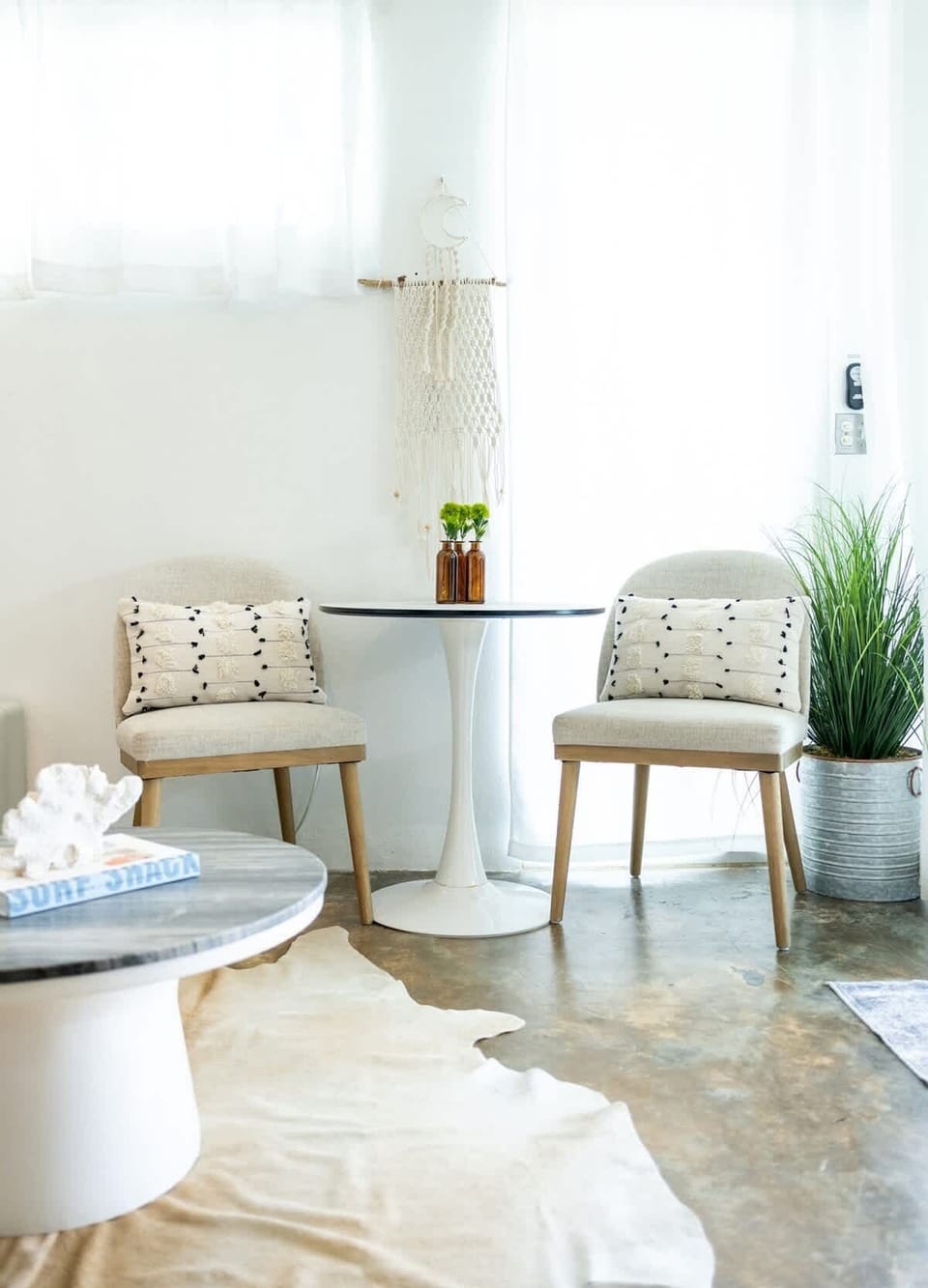 Boho lounge in Rincón, Puerto Rico — cozy chairs, macramé art, and coastal charm for laid-back island living.