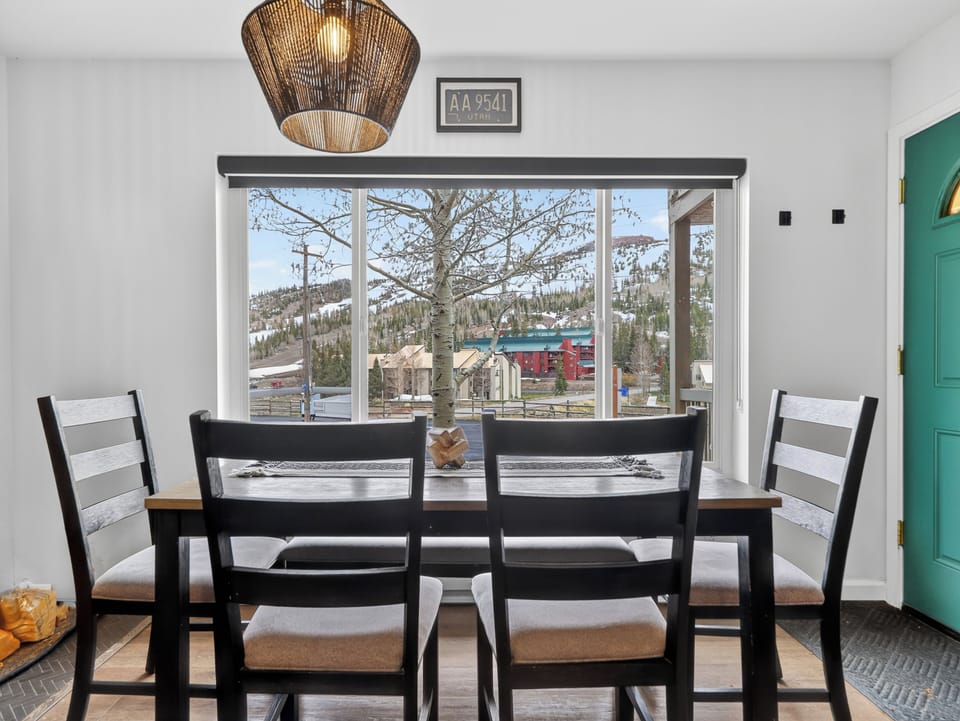Enjoy meals with a view—bright dining space overlooking the mountains