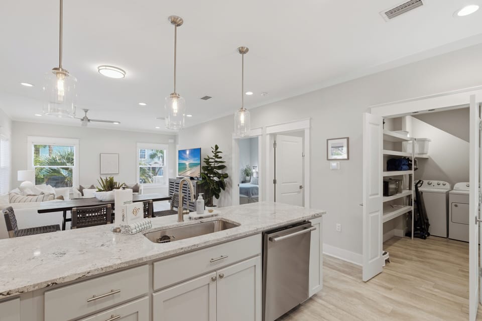 Your gourmet kitchen features marble countertops, stainless appliances, and pendant lighting, perfect for creating memorable meals during your stay.