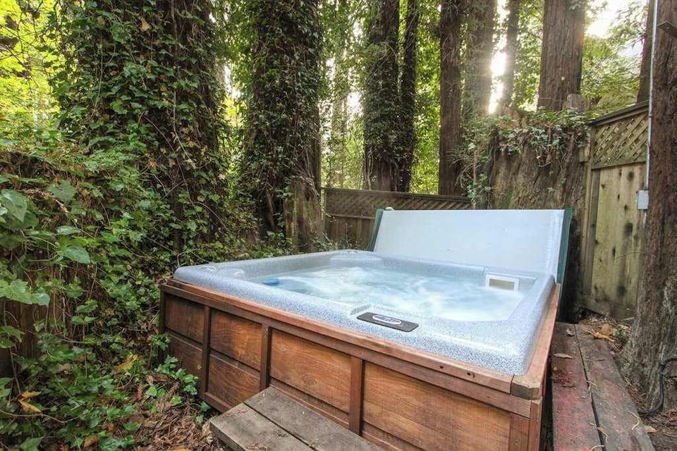 Your bubbling hot tub is draped in ivy and tucked among the trees — the ultimate way to unwind after a day of Sonoma County wine tasting.
