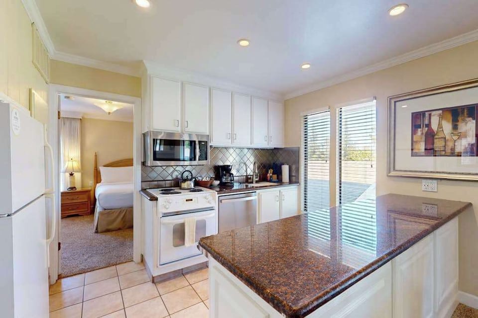 Prep your farm-to-table finds in the full kitchen featuring granite counters, a stove, microwave, coffee maker, and everything you need for a Napa feast.