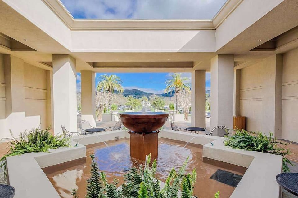 Discover a serene open-air courtyard with a bubbling fountain and mountain vistas — your Silverado spa experience begins before you even step inside.