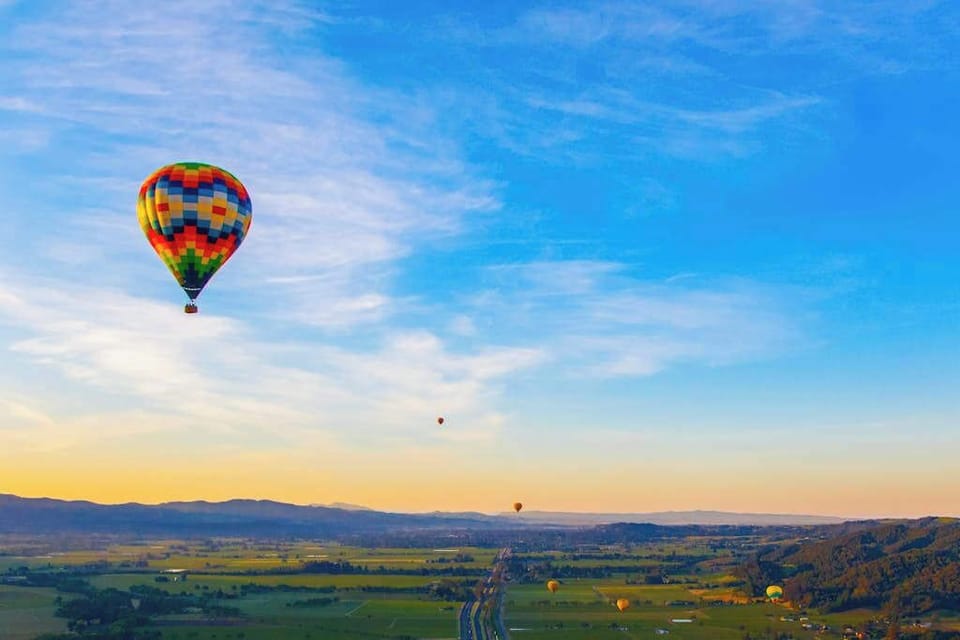 Soar above rolling vineyards on a sunrise hot air balloon ride — one of Sonoma wine country's most unforgettable experiences, booked right from your retreat.