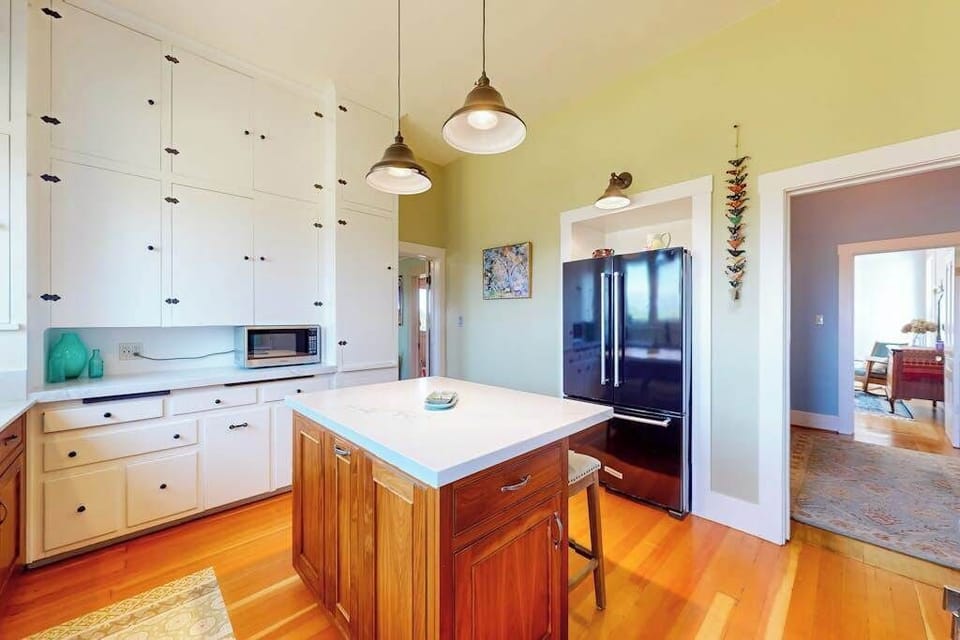 Prep your Healdsburg farmers' market finds on the center island while pendant lights set a warm glow — this kitchen is built for wine country entertaining.