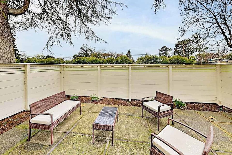 Sip your morning coffee on your private fenced patio — wicker lounge seating and Napa's fresh air make every moment feel like a vineyard escape.