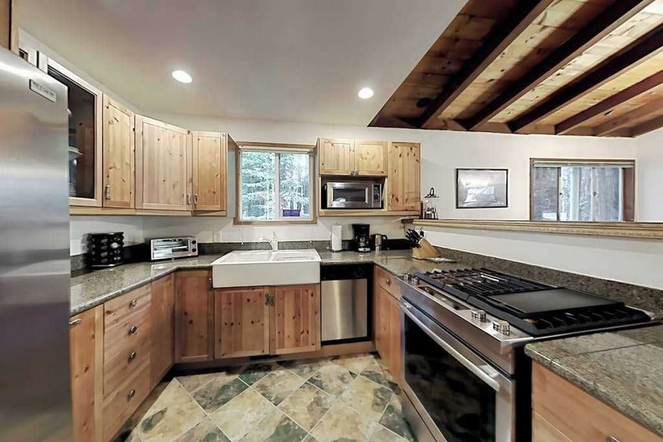 Your well-stocked kitchen features a farmhouse sink, gas range, and all the tools to turn local Sonoma produce into a memorable meal.