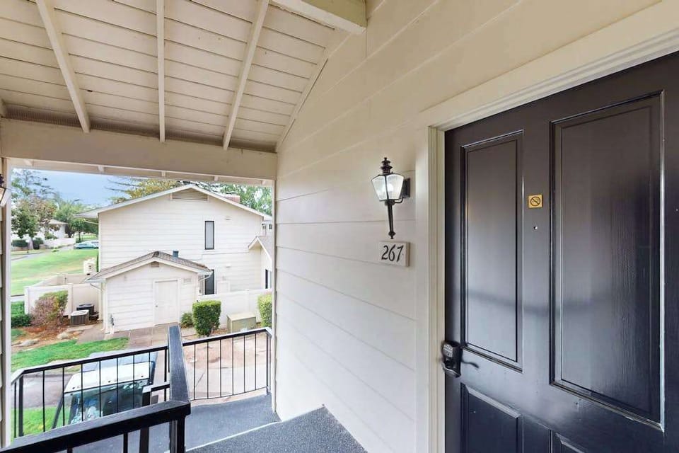 Welcome to Unit 267 — your covered front porch with a charming lantern sets the tone for a relaxing Silverado Resort stay in the heart of Napa.