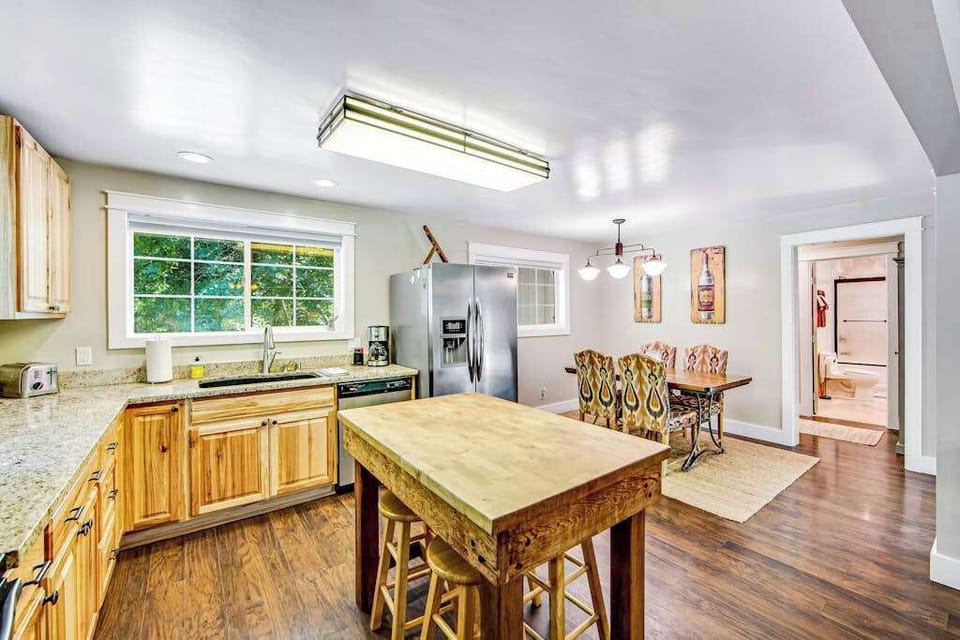 Prepare a harvest-inspired feast in your granite-topped kitchen with island seating and stainless steel appliances