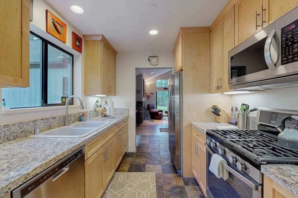 Cook with ease using modern stainless steel appliances while your wine country finds chill in the full-size refrigerator.