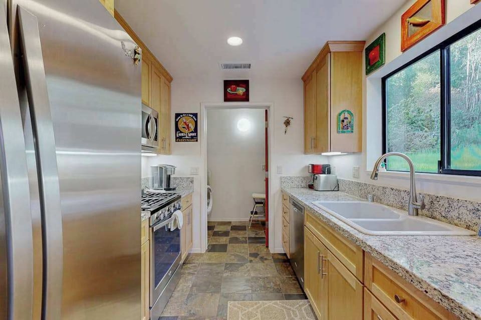 Everything you need to host is right here — oversized refrigerator, gas range, and ample counter space for your Sonoma culinary adventures.