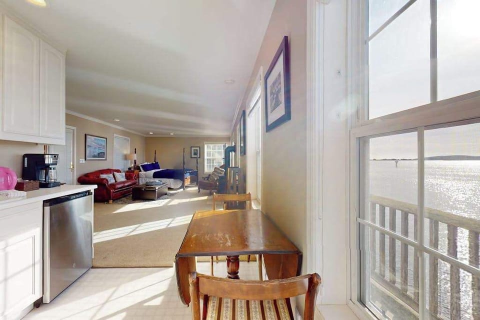 The sun-drenched kitchenette flows into the cozy living space, keeping you connected while you prep Sonoma Coast snacks.