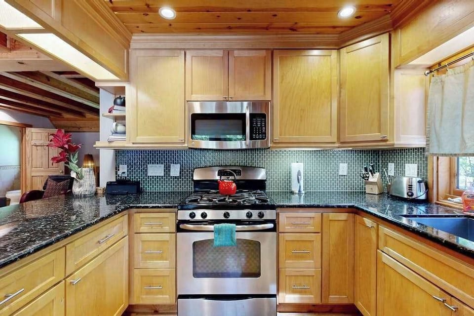Fire up the gas range for a home-cooked feast with your Sonoma farmers' market haul — stainless steel appliances and mosaic backsplash make cooking a pleasure.