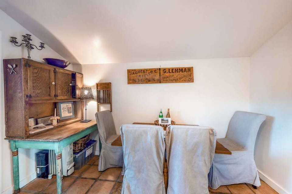 Share a bottle of local Pinot over dinner at your intimate dining nook — vintage farmhouse décor and a rustic hutch set the wine country mood.