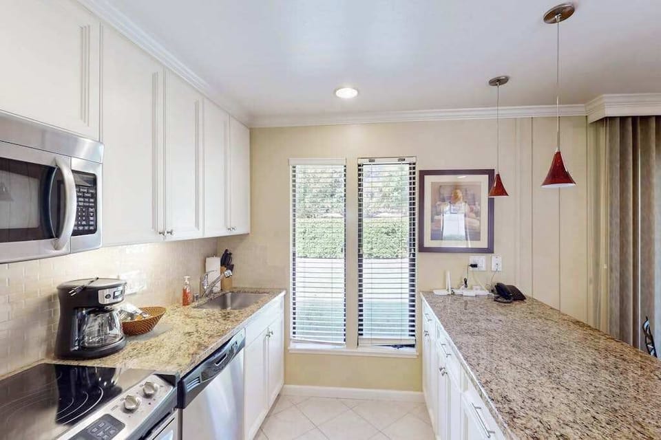 Brew your morning cup with the in-unit coffee maker, then spread out on generous granite counters — your Napa kitchen comes fully equipped for meals between wine tours.