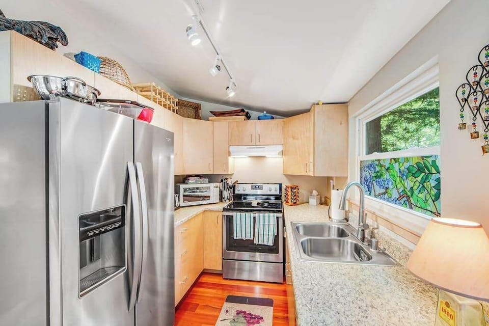 Your full-size kitchen has everything you need to prep wine country picnics or cook a feast — stainless fridge, dishwasher, and ample counter space await.