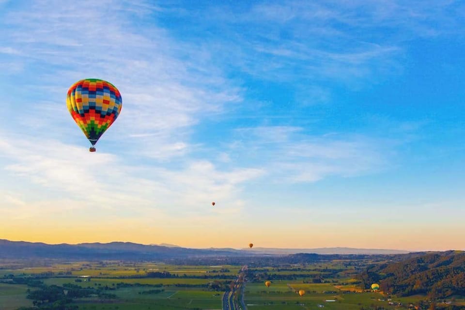 Drift above Napa Valley's patchwork of vineyards in a sunrise hot air balloon — this bucket-list experience launches just minutes from your Silverado Resort cottage.