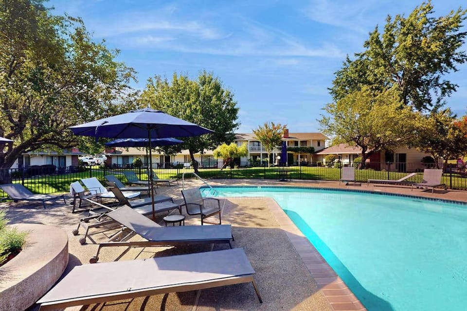 Cool off in your resort pool after a day of Napa wine tasting — lounge chairs and shaded umbrellas await your afternoon unwind