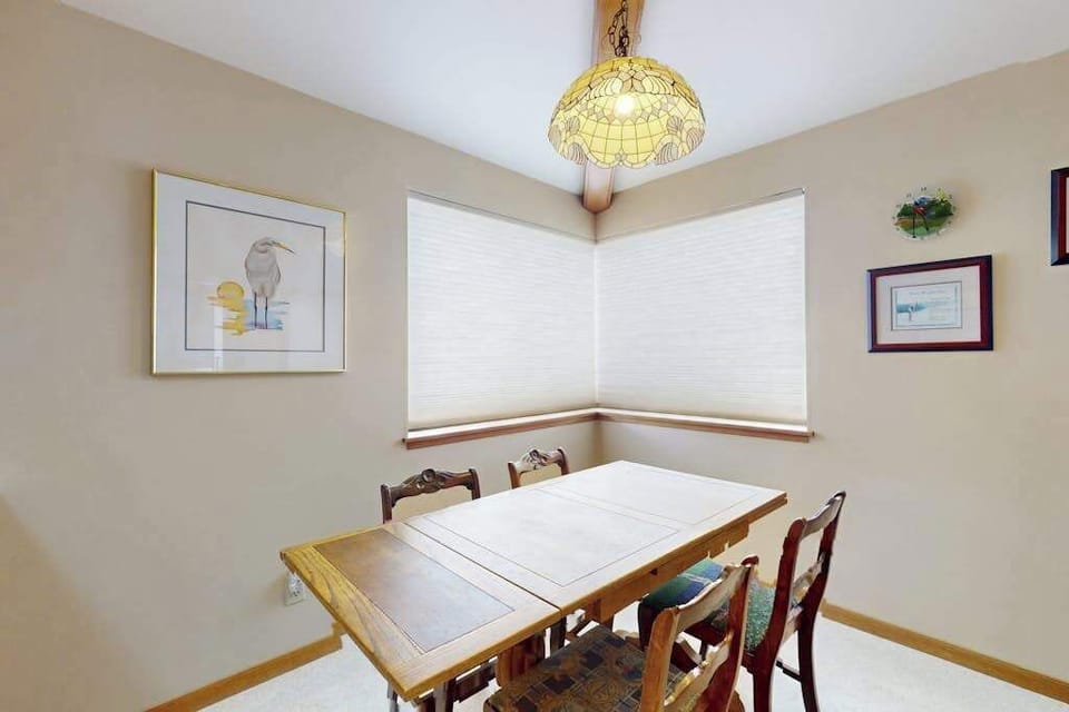 Enjoy a quiet breakfast for four in the charming coastal nook with a Tiffany-style pendant and views of your Bodega Bay surroundings