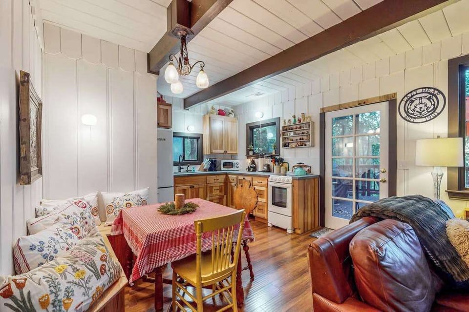 Prepare your winery picnic haul at the farmhouse dining table — the full kitchen behind you has everything you need to cook with Sonoma County's freshest finds.