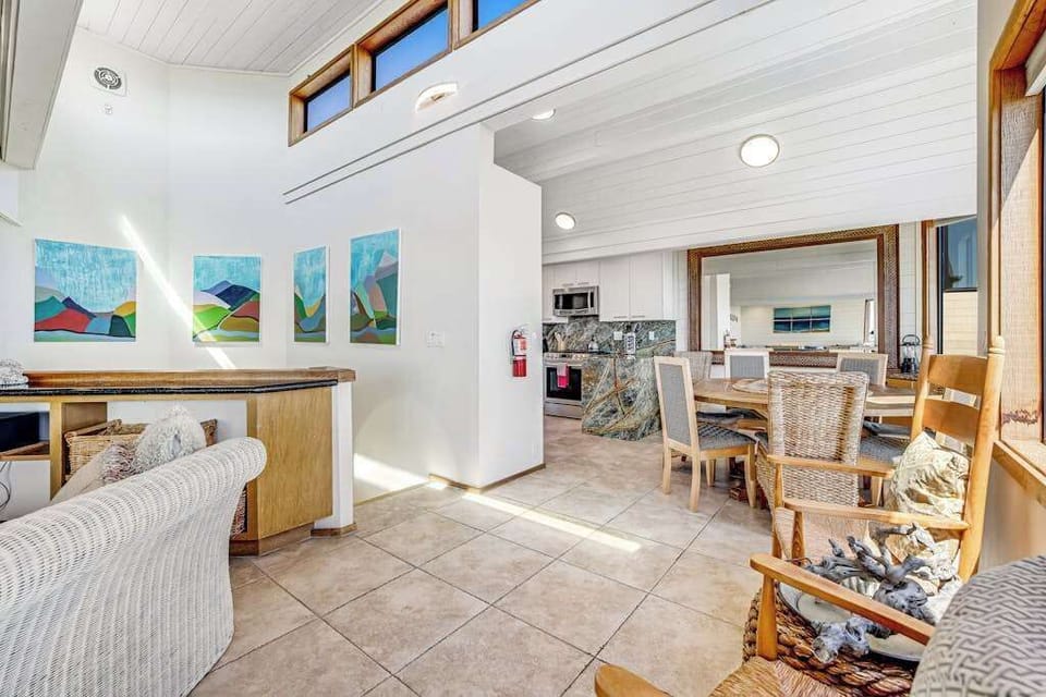 Flow freely from living room to dining to kitchen in your open-plan main level where Sonoma Coast artwork and ocean light set the mood
