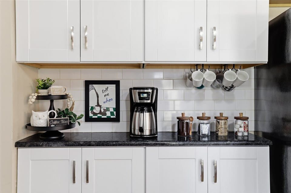 Your morning ritual is sorted! The coffee bar is stocked with a drip maker, French press, mugs and all the fixings