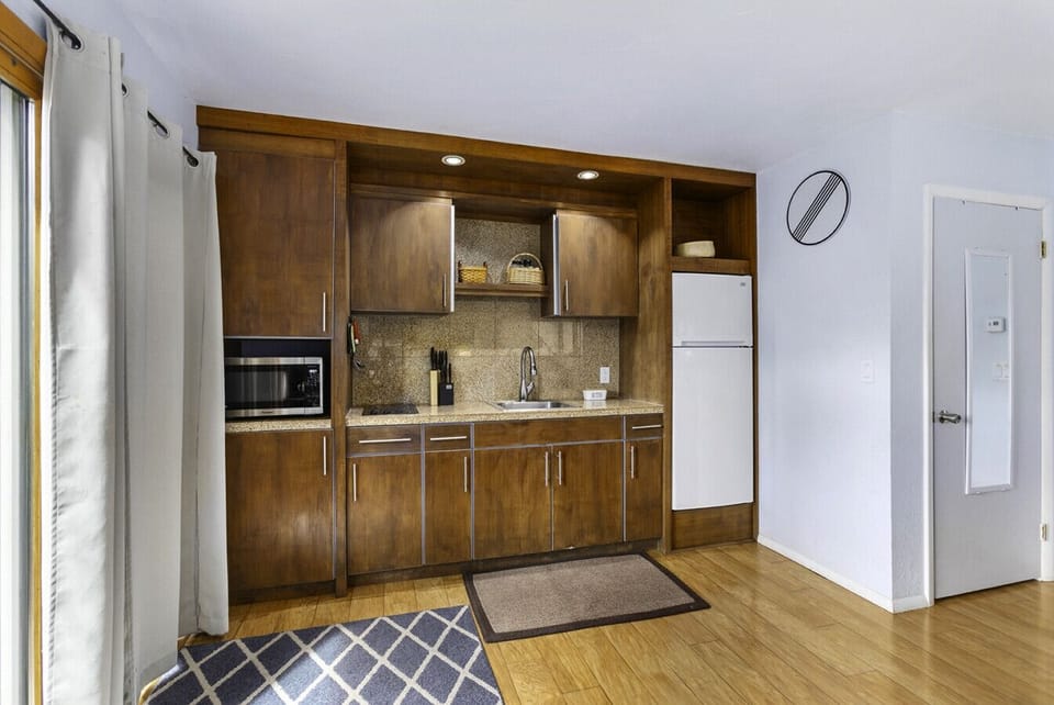 Kitchen area with modern cabinets!