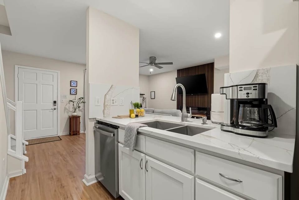 Open, pass through counter area is great for bonding around meal prep, meals, and clean up.  Dishwasher and deep stainless steel double sink makes clean up easy.